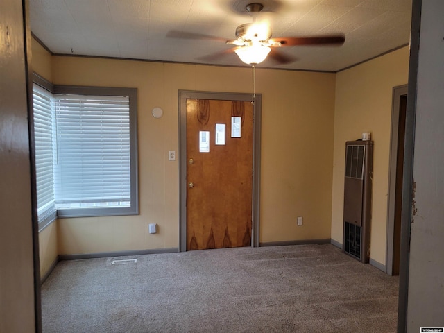 entryway with carpet flooring and ceiling fan