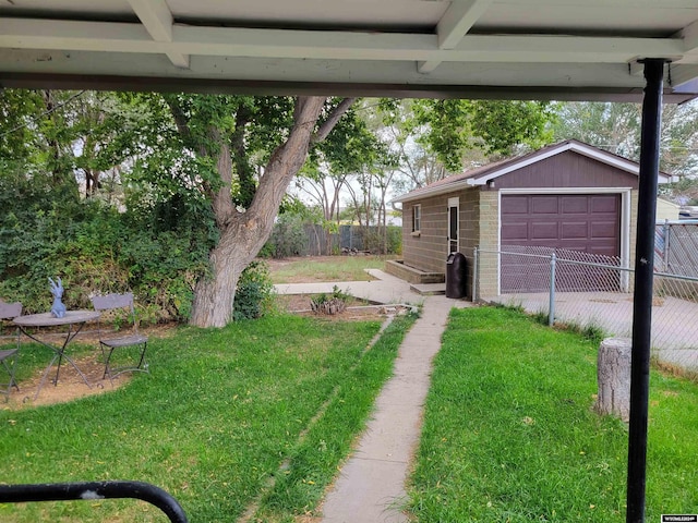 view of yard with an outdoor structure and a garage