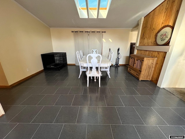 tiled dining room featuring ornamental molding