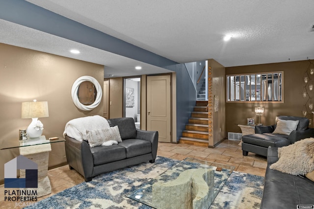 living room featuring a textured ceiling