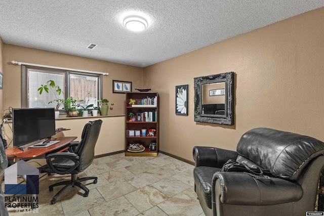 office space featuring a textured ceiling