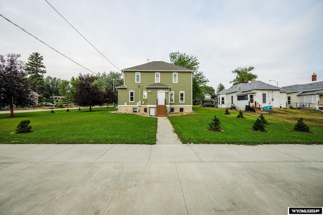 view of front of home featuring a front lawn