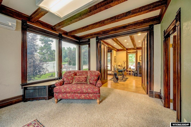 carpeted living room with beamed ceiling and a wall unit AC