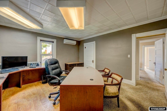 office featuring crown molding, light wood-type flooring, and a wall mounted air conditioner