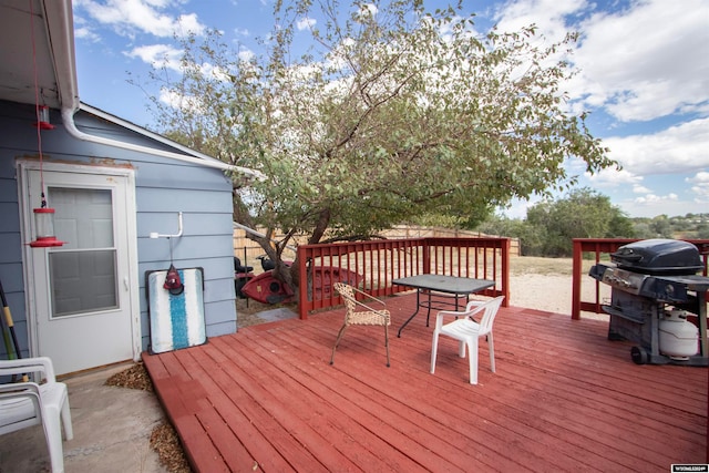 wooden terrace with area for grilling