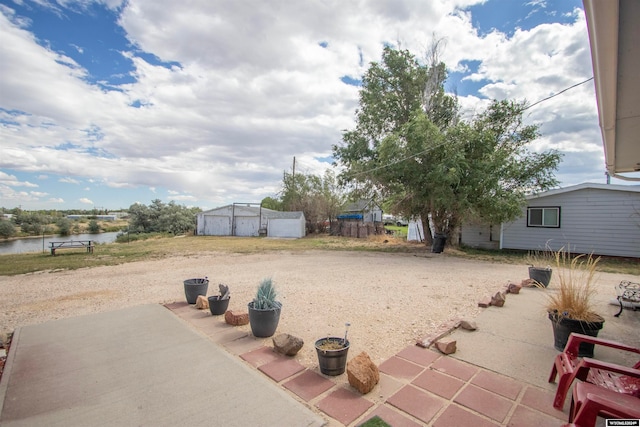 view of patio with a water view