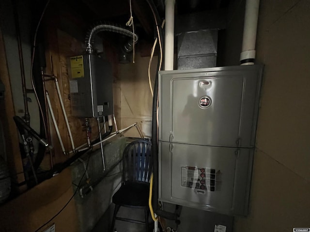 utility room with water heater