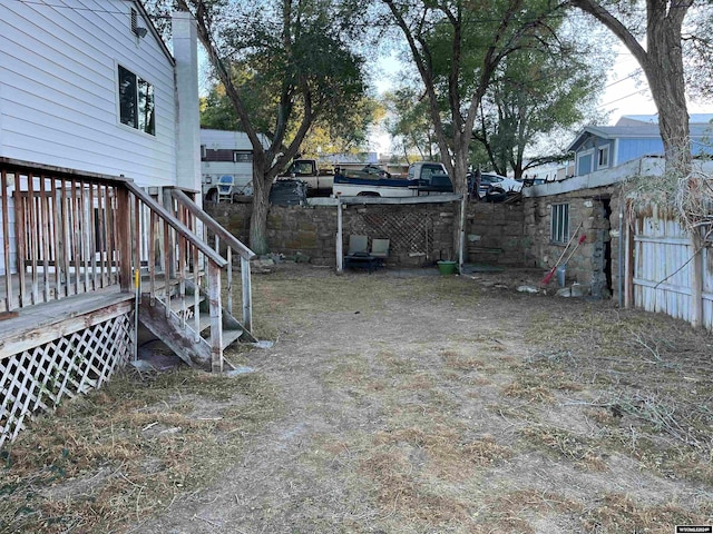 view of yard with a wooden deck