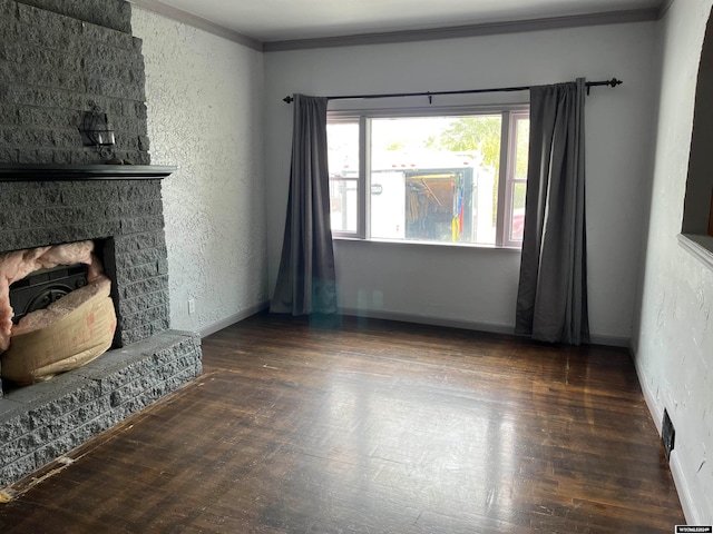 living room with ornamental molding, a fireplace, and dark hardwood / wood-style flooring