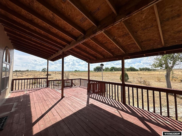 wooden terrace featuring a rural view