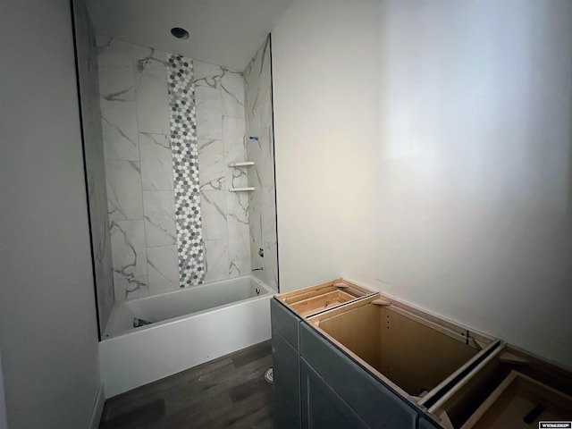 bathroom featuring shower / tub combination and wood finished floors