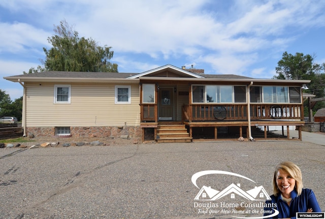 view of front of home with a sunroom