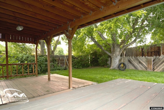 wooden terrace with a yard