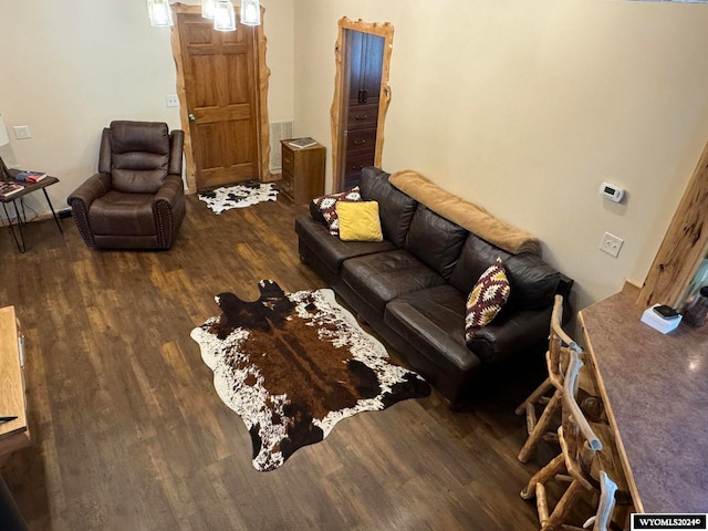 living room with dark hardwood / wood-style flooring