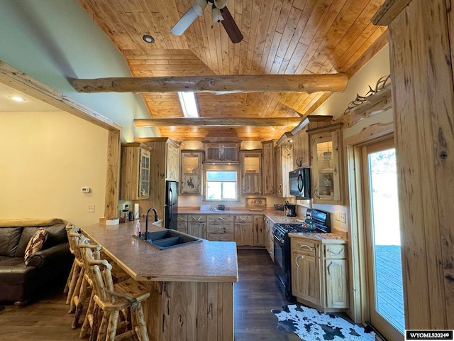 kitchen featuring lofted ceiling with beams, dark hardwood / wood-style floors, black appliances, ceiling fan, and wooden ceiling