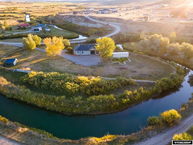 bird's eye view featuring a rural view and a water view