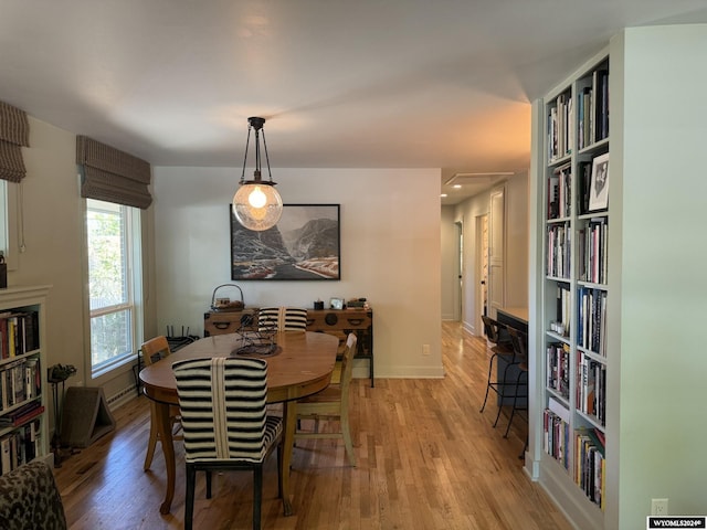 dining space with light wood-type flooring