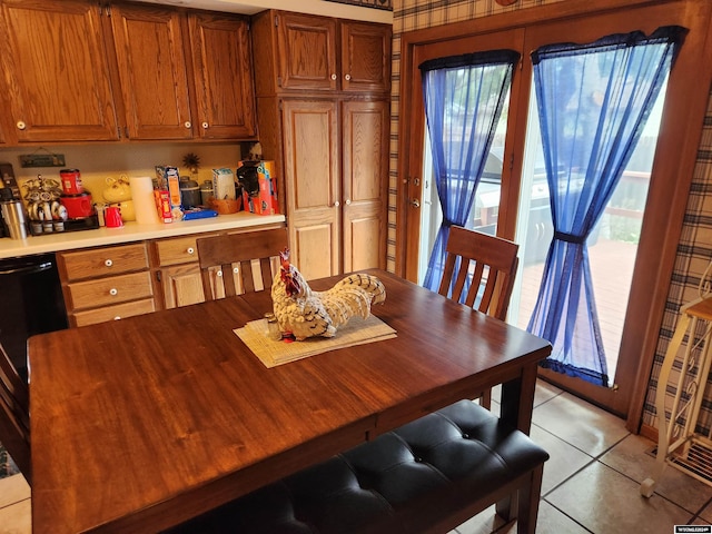 dining space featuring light tile patterned flooring