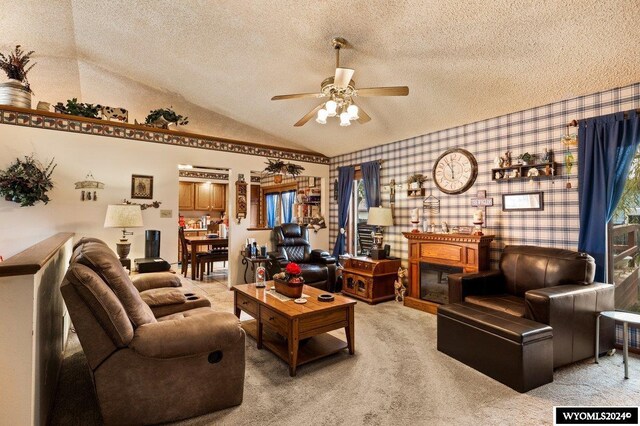 2226 E I St, Torrington, WY 82240 - living room with a textured ceiling, light colored carpet, a ceiling fan, wallpapered walls, and vaulted ceiling