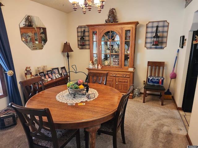 carpeted dining space with a textured ceiling and an inviting chandelier