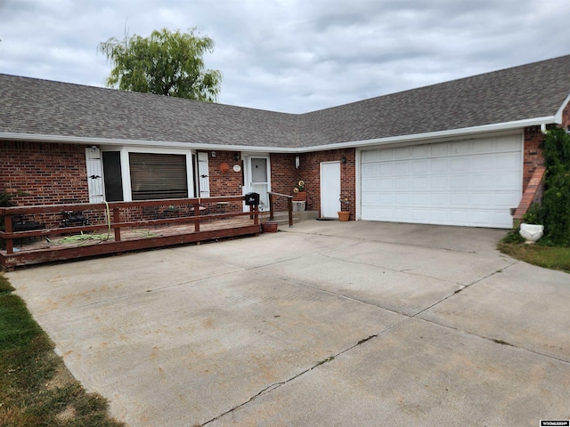 ranch-style house featuring a garage