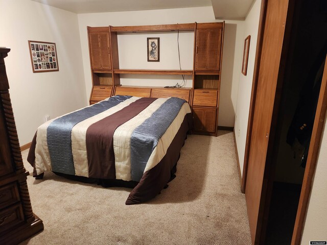 bedroom with light colored carpet