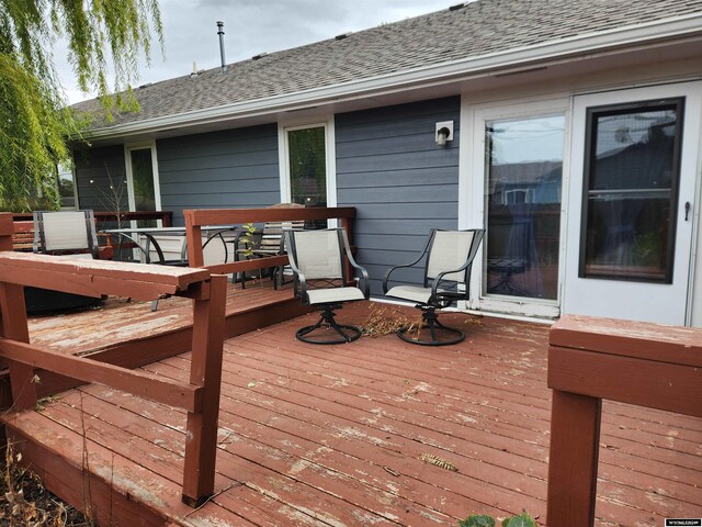 2226 E I St, Torrington, WY 82240 - single story home with driveway, a garage, brick siding, and roof with shingles