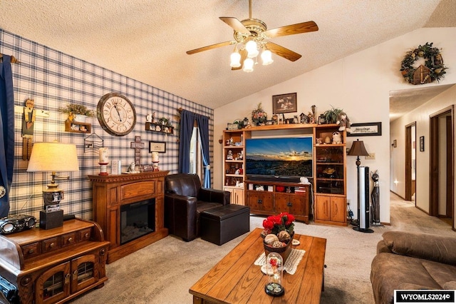 living room featuring ceiling fan, a textured ceiling, light carpet, and lofted ceiling