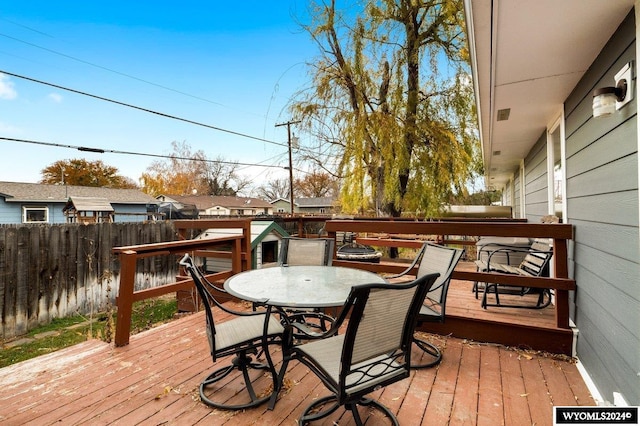 2226 E I St, Torrington, WY 82240 - wooden deck with a fenced backyard and outdoor dining space