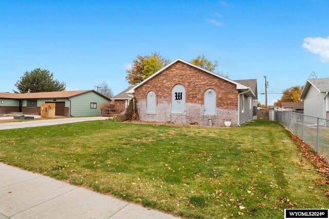 2226 E I St, Torrington, WY 82240 - full bath with a stall shower, double vanity, and wood finished floors