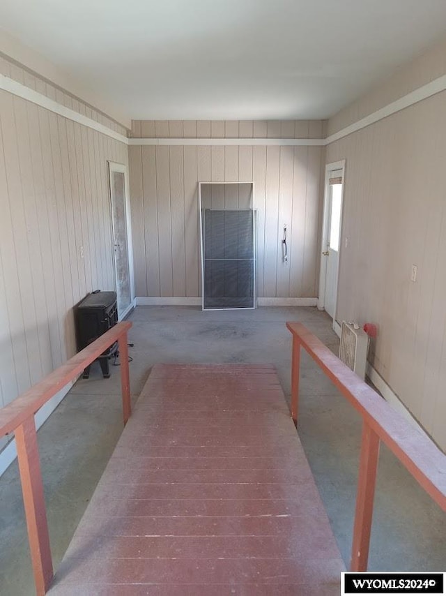 living room with wooden walls