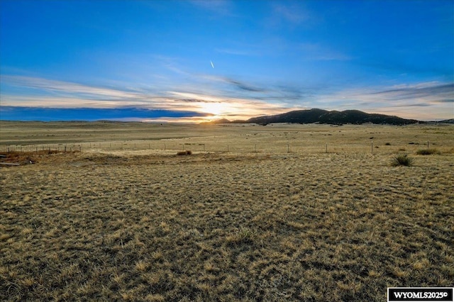 view of mountain feature with a rural view