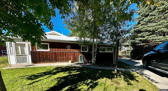 view of home's exterior featuring a lawn