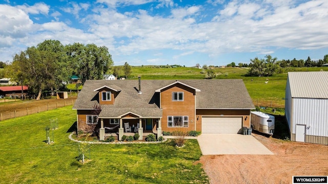 view of front of home with a garage and a front lawn