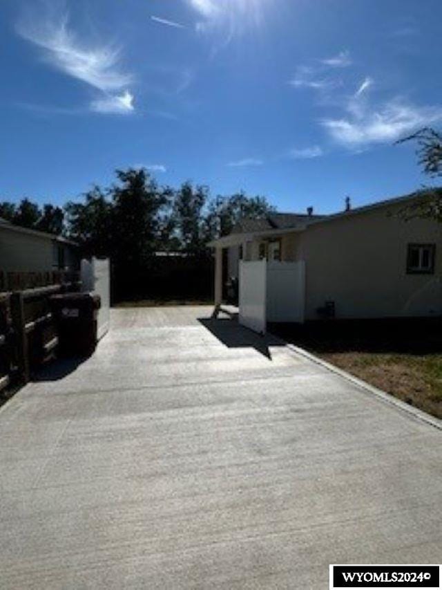 207 W Walnut Sts, Lyman, WY 82937 - view of side of home featuring fence