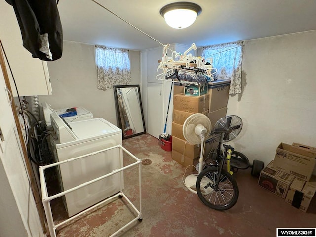 basement featuring washing machine and clothes dryer