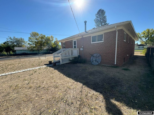 back of house featuring a deck