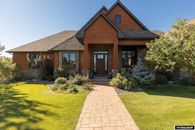 craftsman inspired home with a front lawn