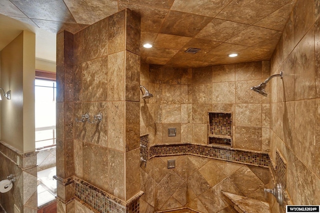 bathroom with tiled shower