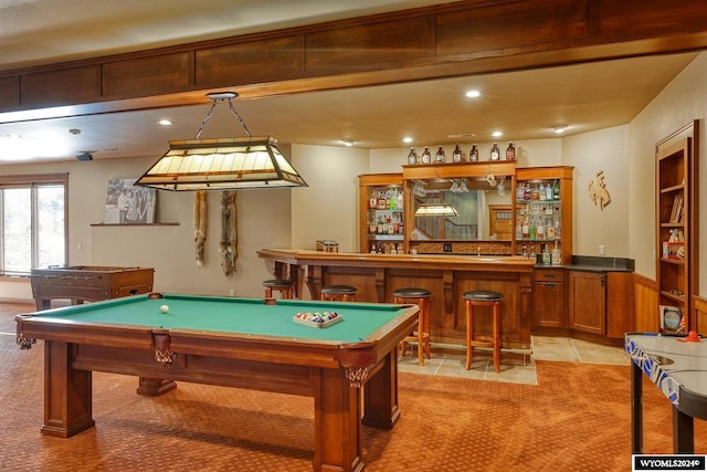 game room featuring pool table, bar area, and light tile patterned floors