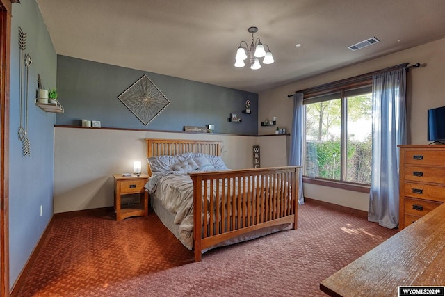 carpeted bedroom with an inviting chandelier