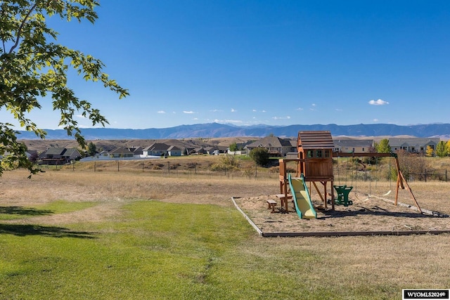 view of jungle gym featuring a mountain view