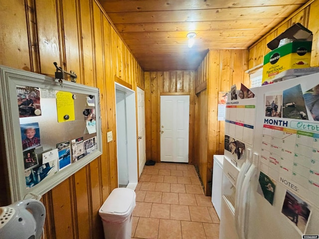 laundry area with wood walls and wooden ceiling