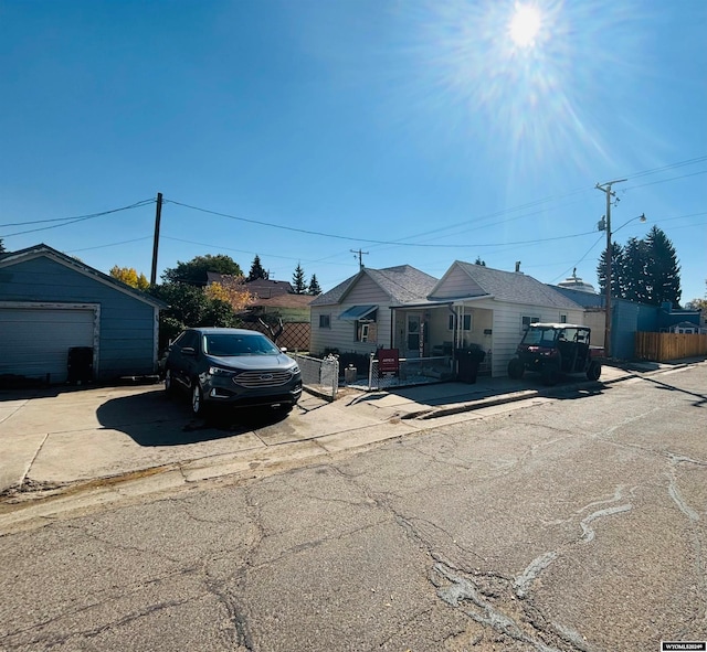 view of front of home featuring an outdoor structure and a garage