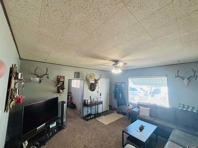 living room featuring ceiling fan and carpet flooring