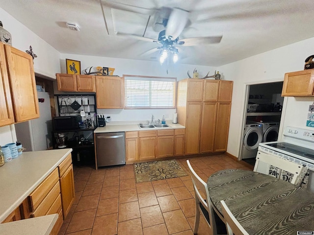 kitchen featuring light tile patterned flooring, separate washer and dryer, ceiling fan, stainless steel dishwasher, and sink