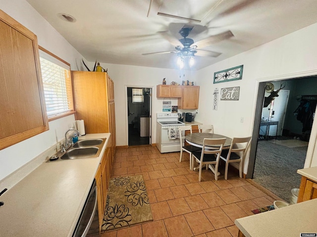 kitchen with sink, white electric range oven, light tile patterned floors, ceiling fan, and stainless steel dishwasher