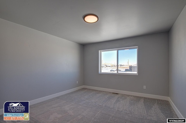 unfurnished room featuring carpet