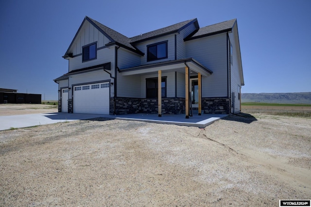 view of front of house with a garage and covered porch