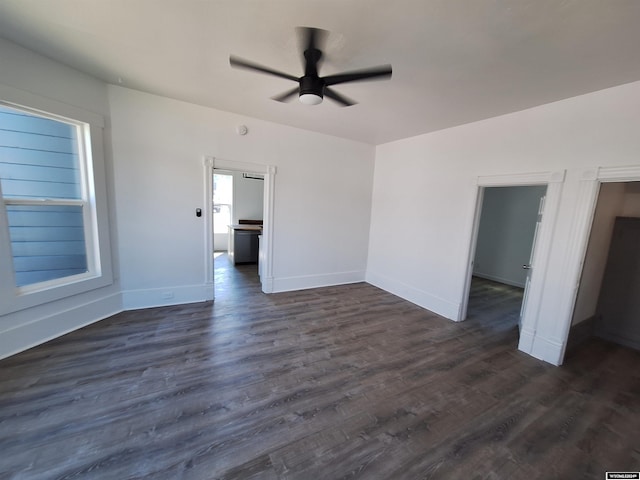 spare room featuring dark hardwood / wood-style floors and ceiling fan